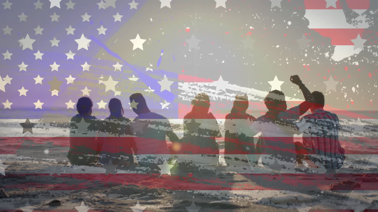 Animation of flag of usa over diverse friends sitting on beach