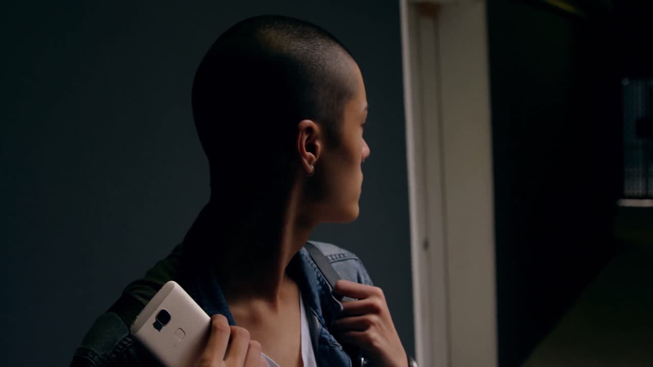 Man looking away in corridor 4k