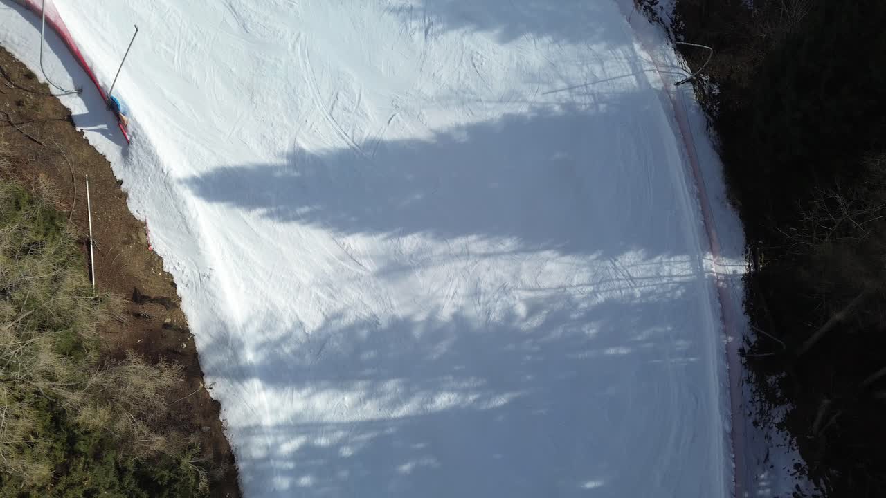 There are winter sports that play the role of the Winter Olympics in Cortina and Milano Italy. Learning to ski and snowboard I capture these videos with my drone that is in a ski resort. snow thite