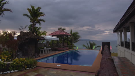 relaxing sunrise time lapse of a pool with beach in the background located in panglao bohol, philippines