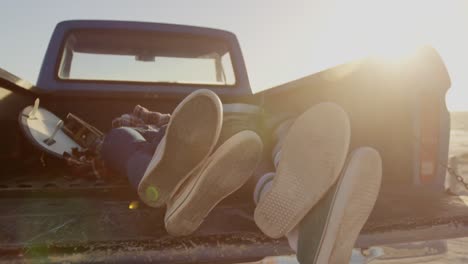 couple relaxing in pickup truck at beach 4k