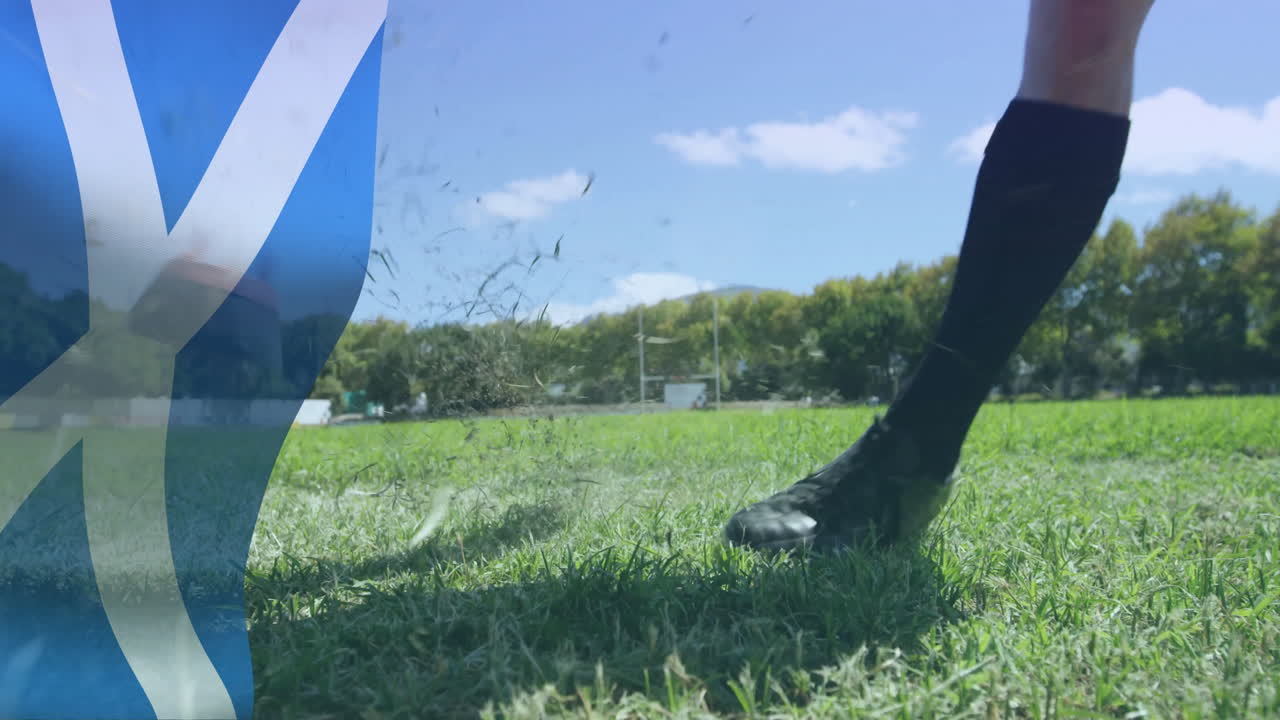 Animation of flag of scotland over caucasian male rugby player kicking ball