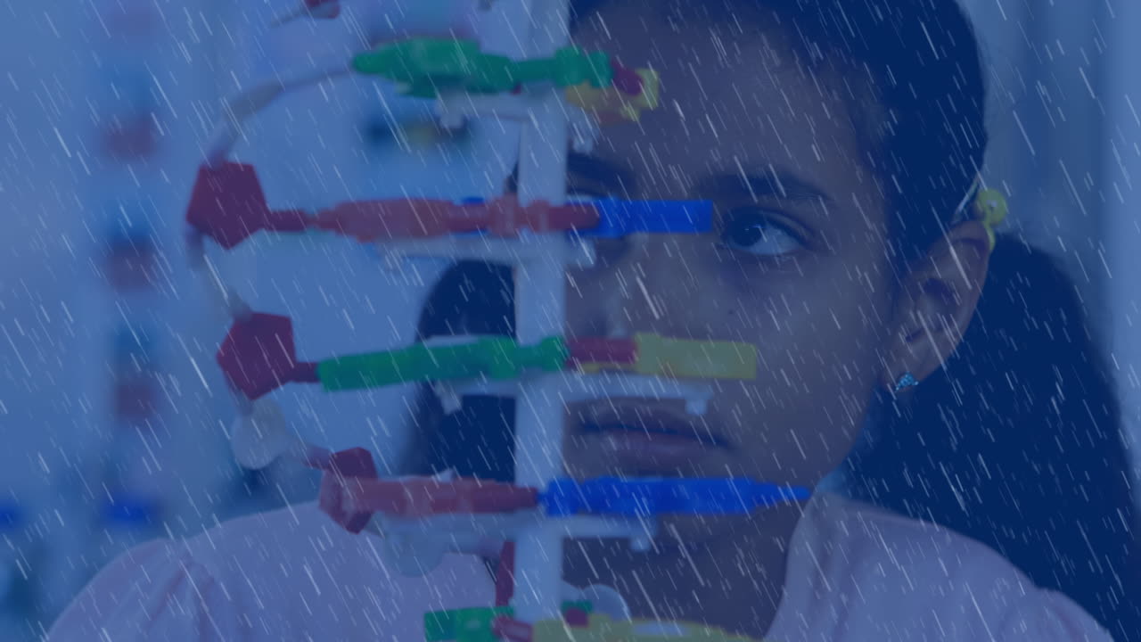 Animation of rain over biracial female student in lab