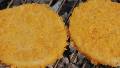 veggie orange burger on grill, carrot and oats burger with corn and yellow pepper, vegetarian food barbeque, potato grill burger.
