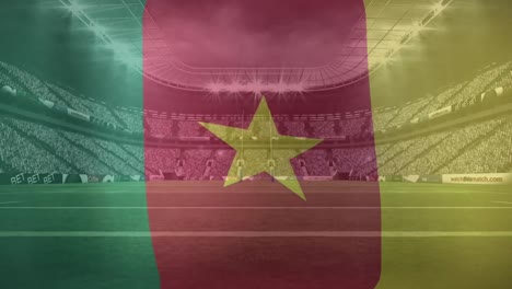 Animación-De-Ondear-La-Bandera-De-Camerún-Contra-La-Vista-De-Un-Estadio-Deportivo.