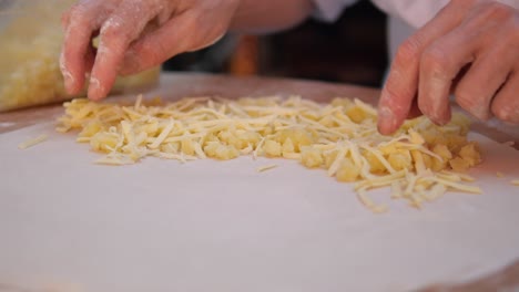 preparing a potato and cheese pastry