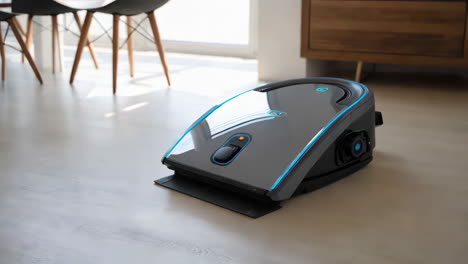 modern robotic floor cleaner on a light wooden floor