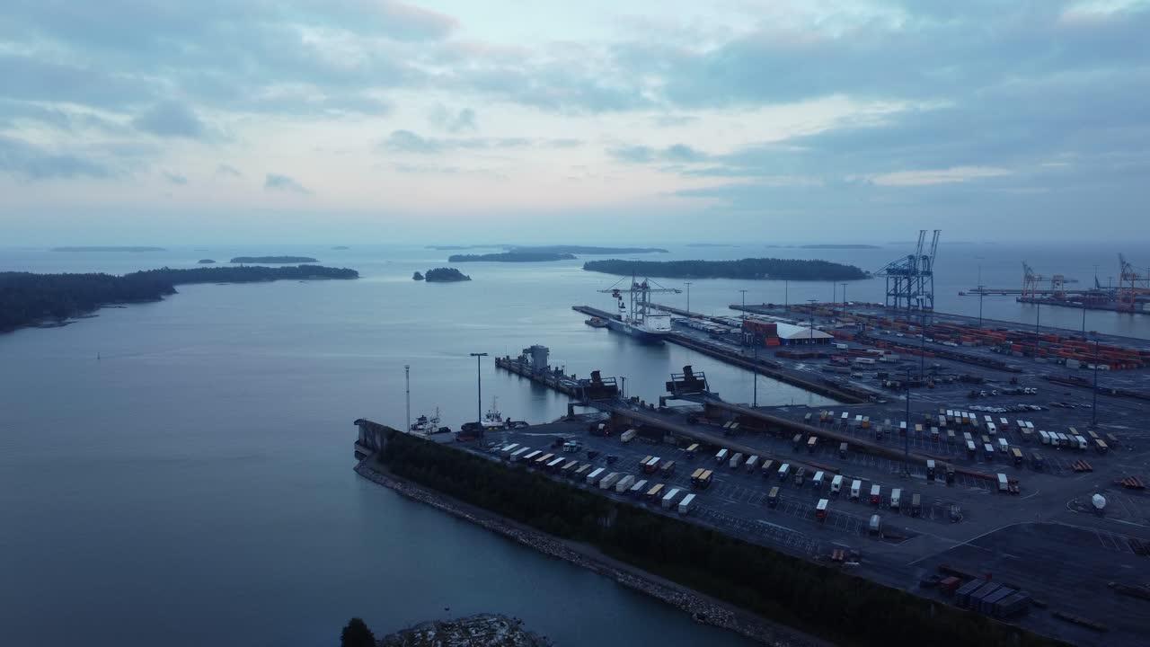 Aerial View of Harbor with Cranes and Trucks
