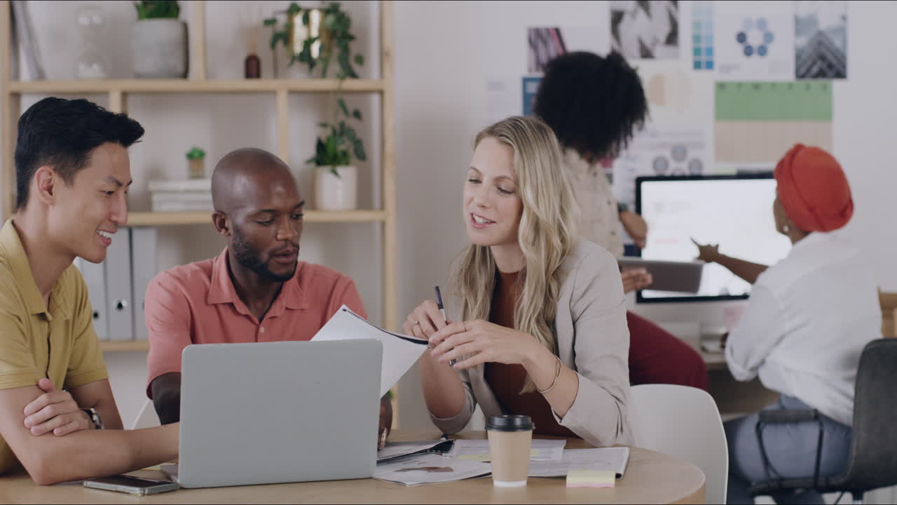 Group of employees at work talking