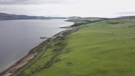 great cumbrae, scotland - passengers and vehicles traveling off the ferry crossing onto land