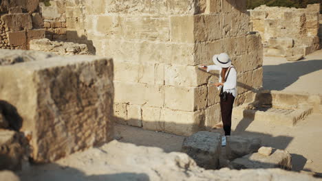 woman exploring ancient ruins