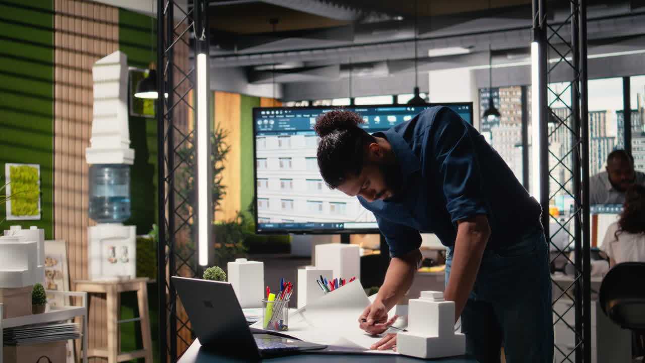 Middle eastern engineer reviewing construction site measurements