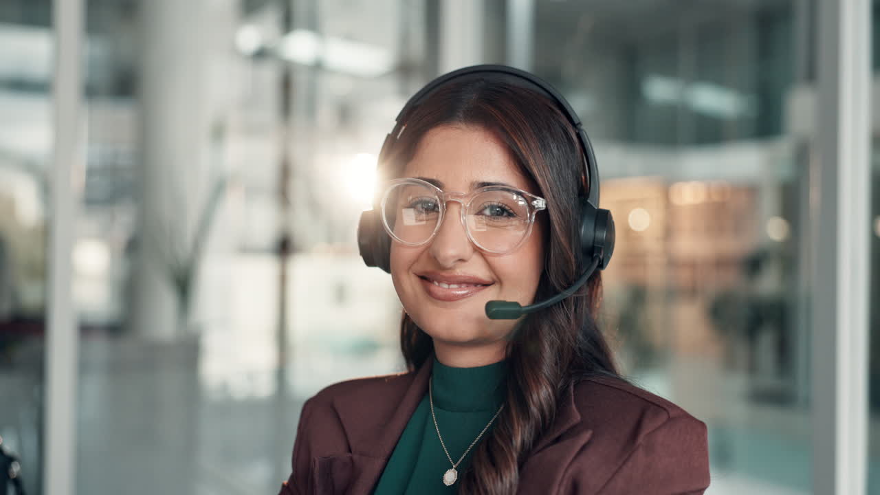 Professional woman with headset in call center environment