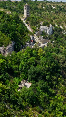 aerial view of rock monastery. beautiful mountainous landscape with rocky cliffs. vertical video