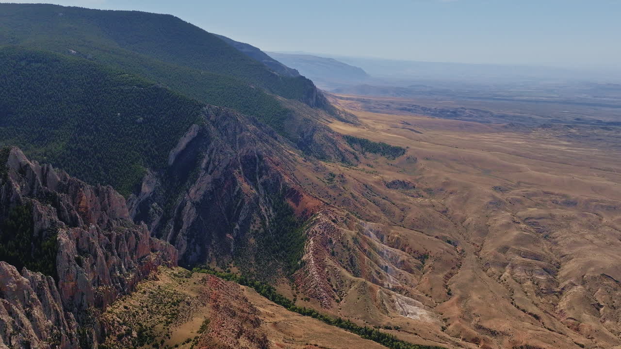 Drone captures the contrast of vibrant rock layers and desert landscapes in the American West.
