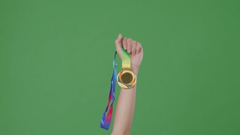 person holding a gold medal