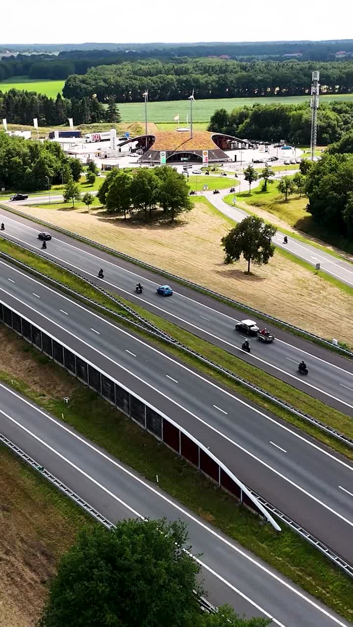 Aerial View of Highway Traffic and a Service Station