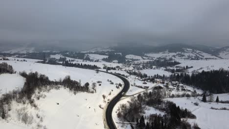 Aerial-View-of-Winter-Fog-in-Snowy-Mountain-Landscape-in-Ukraine