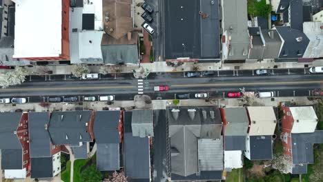 Red-Pick-Up-Vehicle-on-main-street-of-american-town-during-daytime