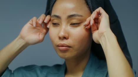 woman doing facial massage