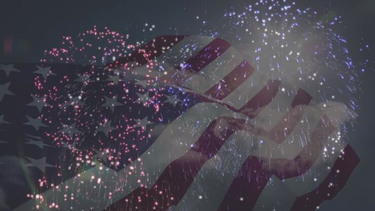 Animation of flag of america waving over fireworks