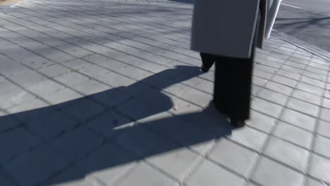 person walking on a sidewalk
