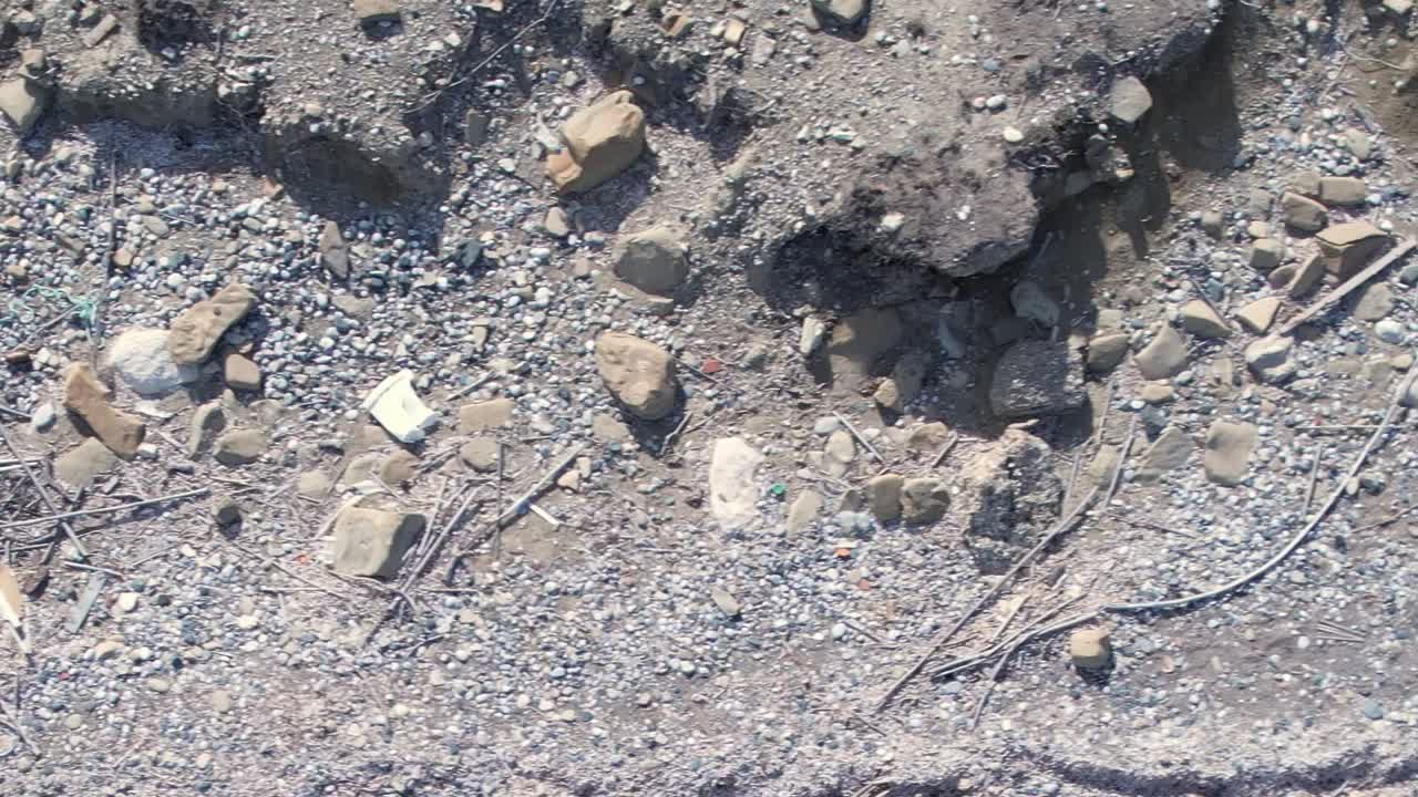Scenic aerial view of rocky shoreline in Greece during sunny weather