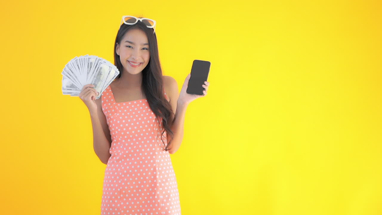 Rich asian showing off money and a new phone