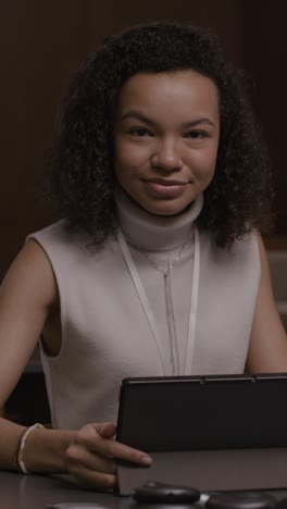 young woman using tablet at business conference