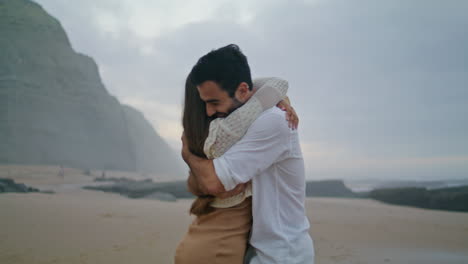 Happy-couple-hugging-at-sunset-closeup.-Emotional-lovers-celebrating-engagement