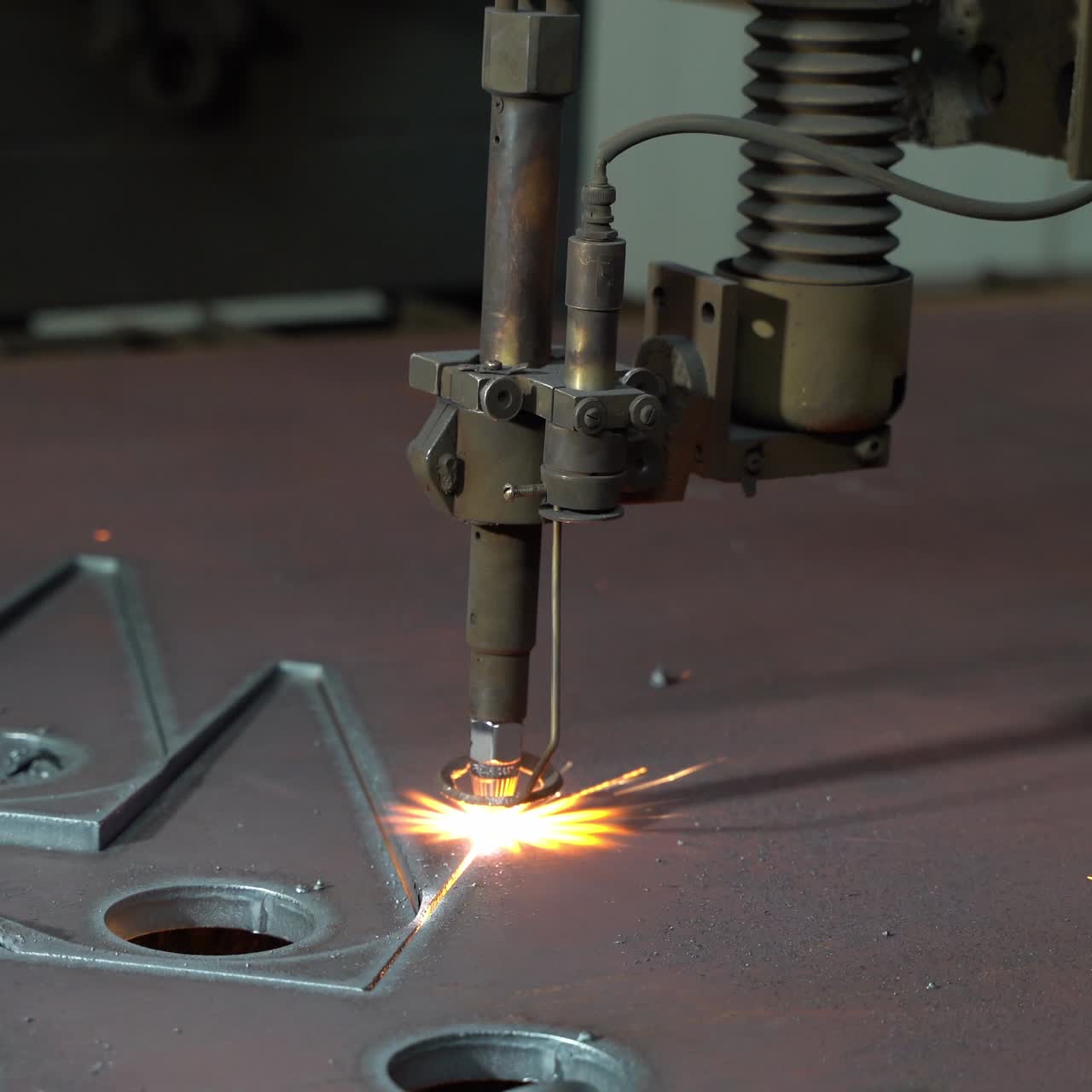 Plasma cutting of metal on an automatic laser machine. Laser plasma cutting machine for cutting parts from metal. Production Industry.