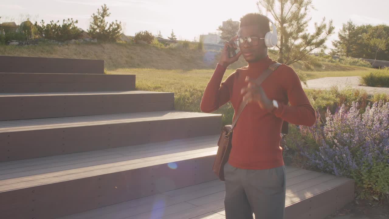 African American Man in Headphones Outdoors