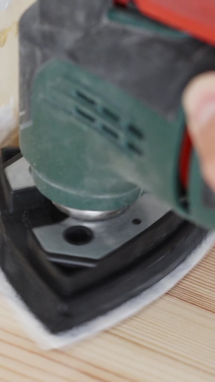 Precision tool cleans and softens wood surface in a detailed vertical close-up