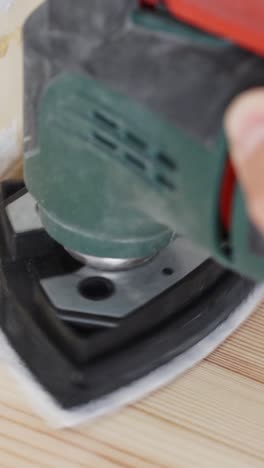 precision tool cleans and softens wood surface in a detailed vertical close-up