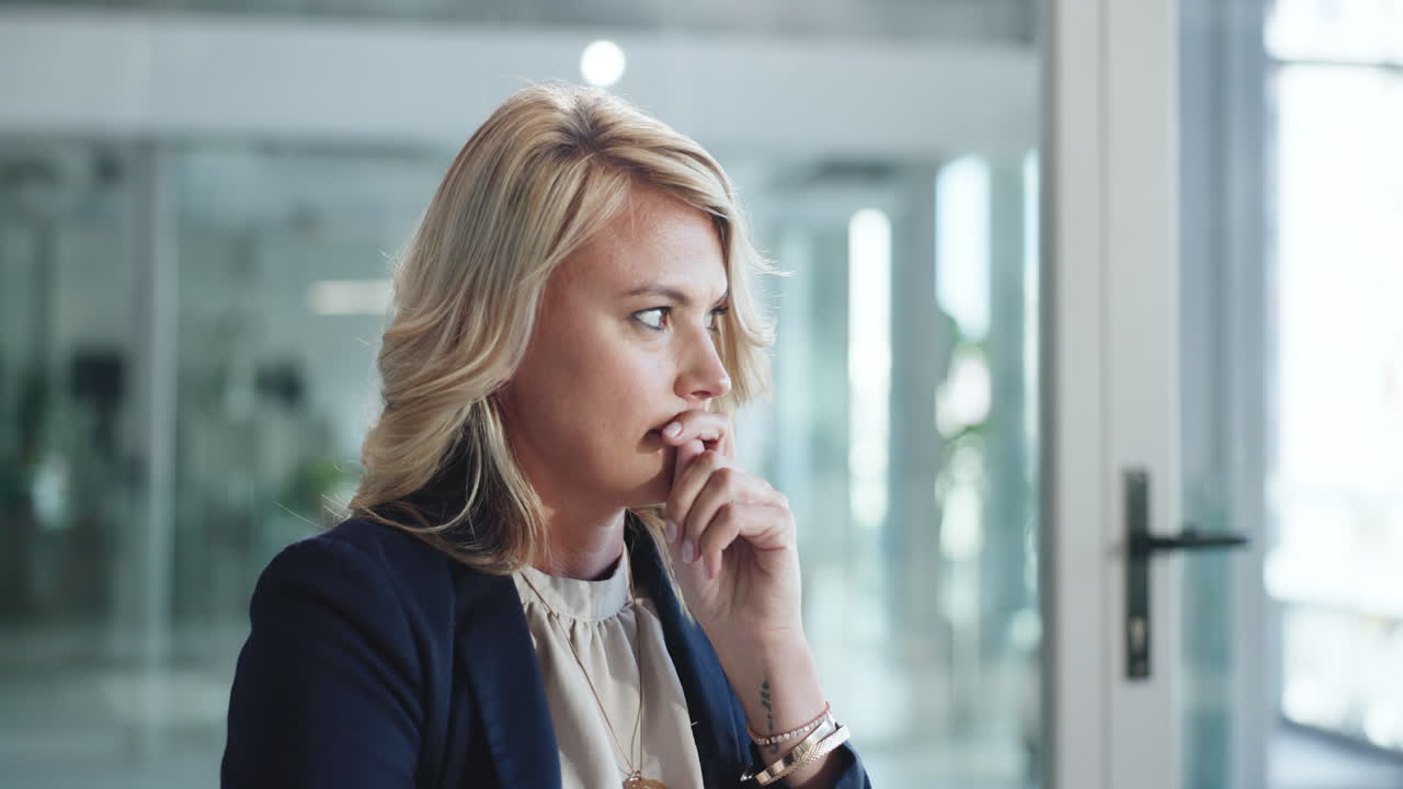 Blonde Businesswoman Thinking and Contemplating in Modern Office
