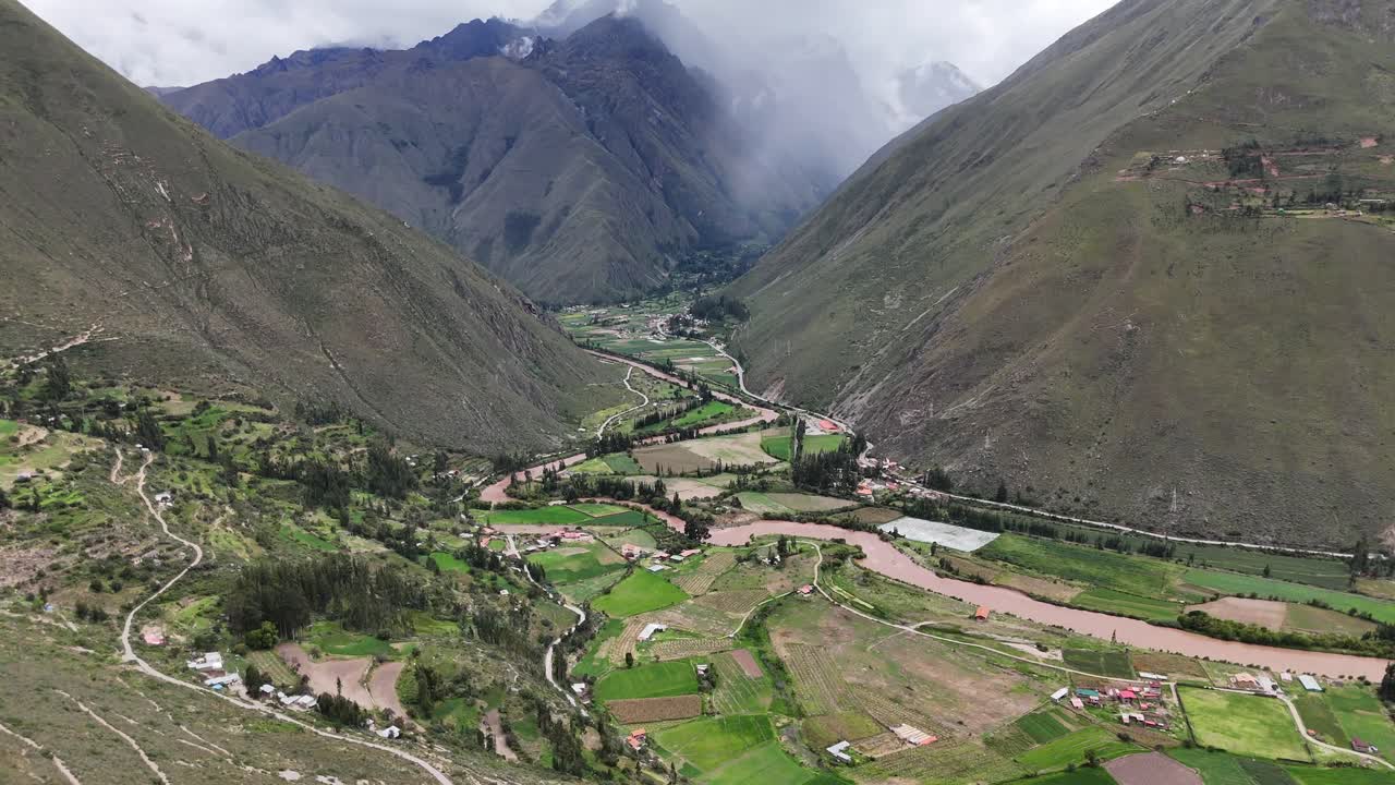 Aerial Drone view of Ollantaytambo Inca city town in Peru mountains and Inca ruins Sacred Valley