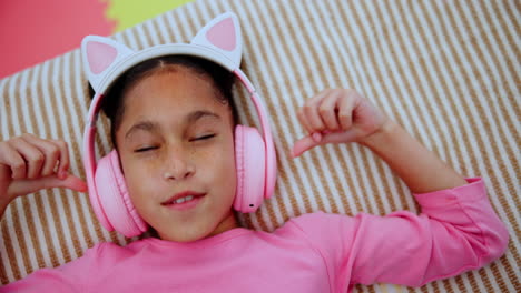 girl relaxing with headphones and cat ears