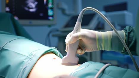 medical ultrasound procedure: a close look at an abdominal examination with advanced imaging technology, highlighting precision and care in a clinical environment.
