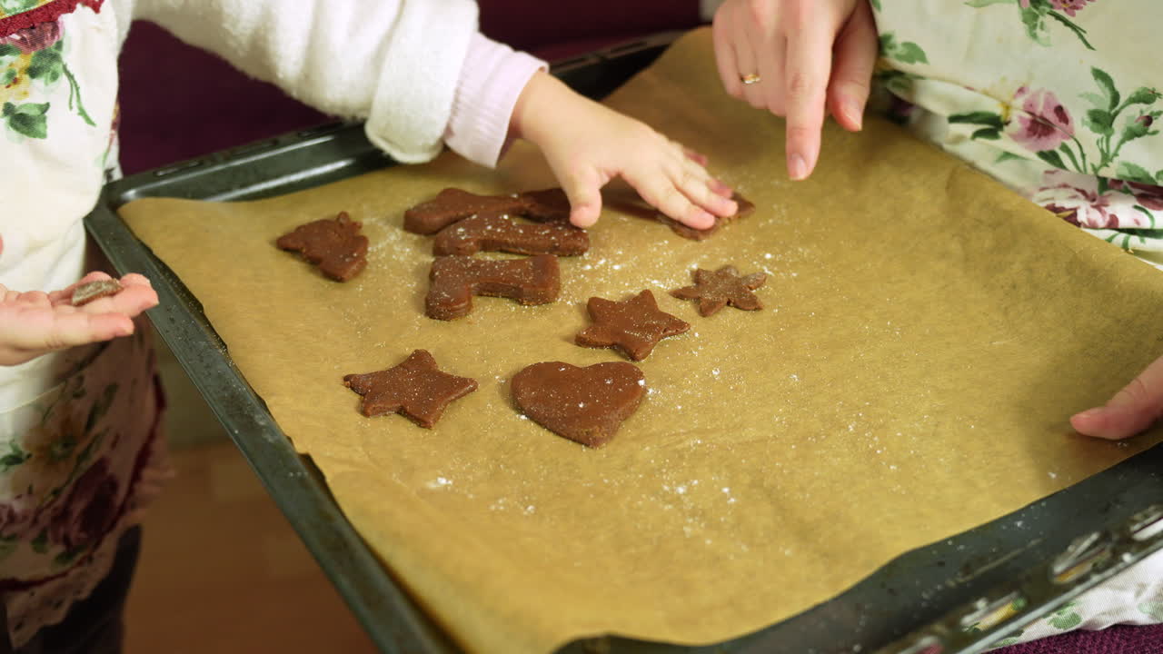 Child baking gingerbread cookies, joyful Christmas moment in cozy home kitchen