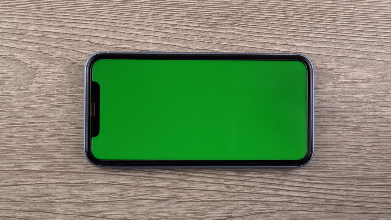 Smartphone with green screen mockup swipe scroll gesture hand close up mobile