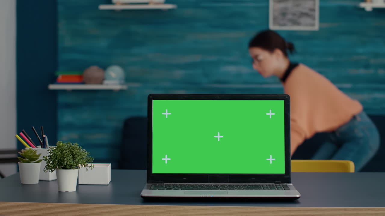 Green screen on modern laptop computer in living room