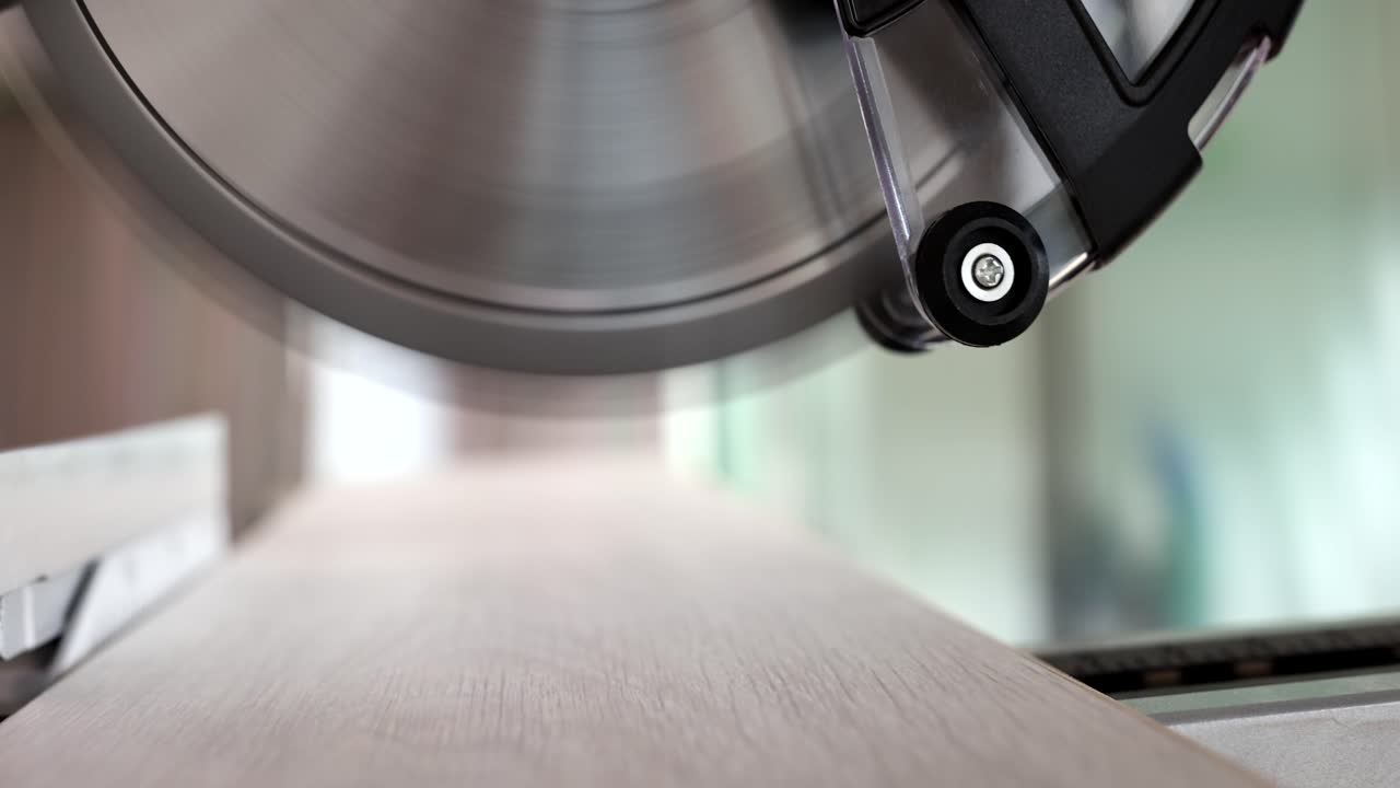 Close-up of a circular saw cutting wood