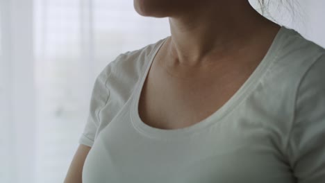 tilt up video of pensive future mom in bedroom.