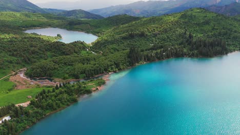aerial footage of sary-chelek lake, kyrgyzstan enchanted forest with lake
