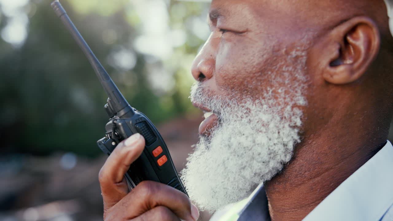 Construction worker using walkie talkie