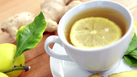 Lemon-tea-with-lemon,-sliced-ginger-and-herb