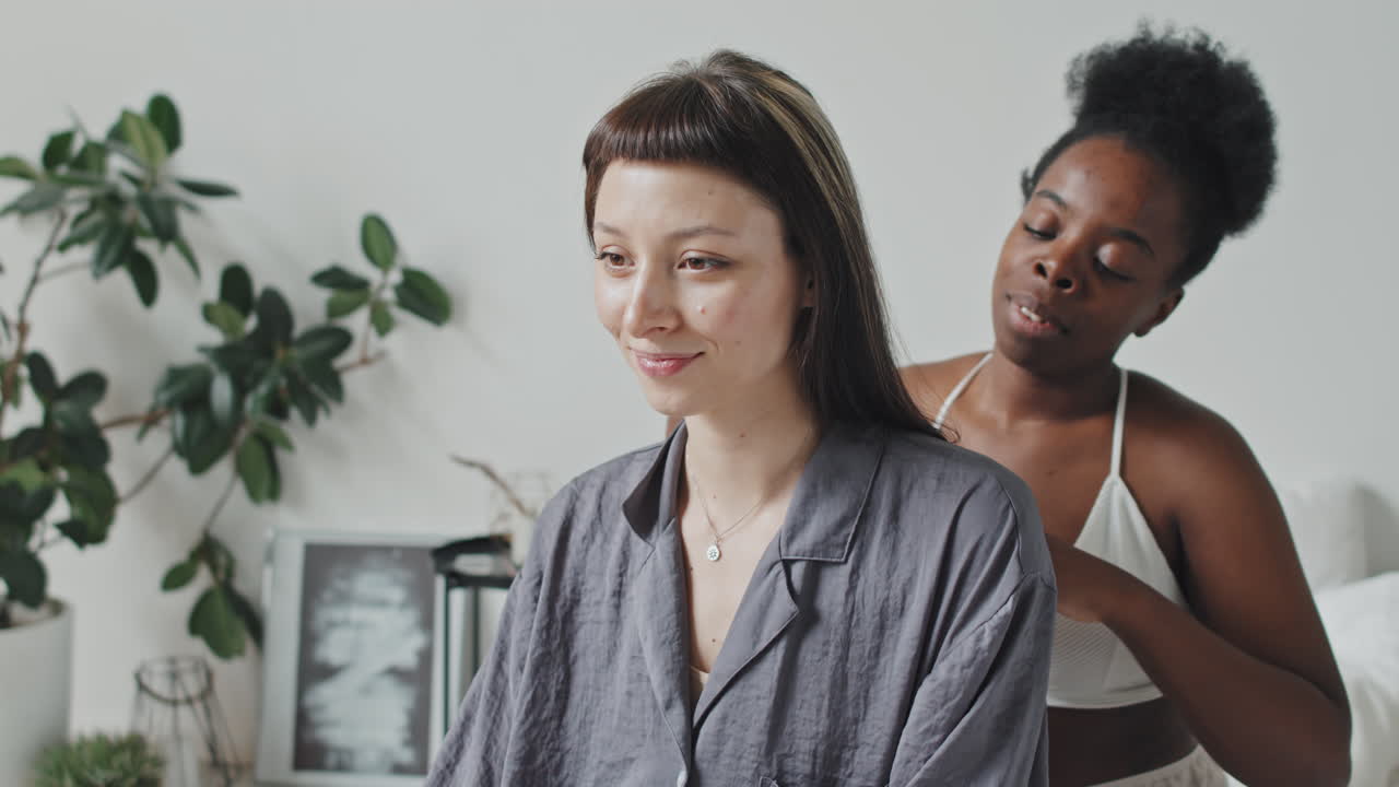 Portrait of Enamored Lesbian Couple Hugging in Bedroom