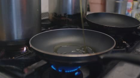 adding the oil into a pan