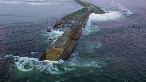 Aerial-View-Of-North-Jetty-In-Bullards-Beach,-Bandon-Oregon---aerial-drone-shot