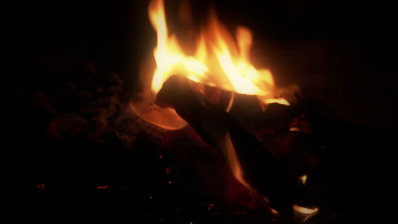 Bright Campfire Flames Burning Wood Logs at Night